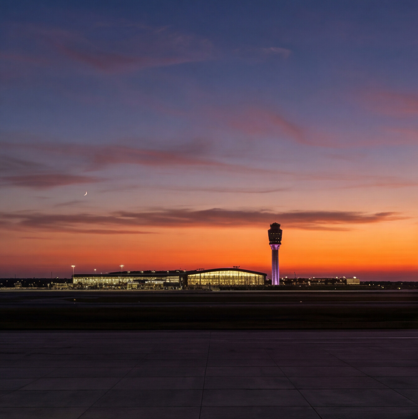 Airport control tower at sunset